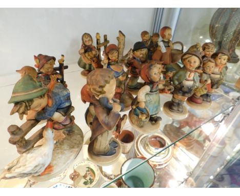 A collection of Goebel figures &amp; a similar 1970's plate, eighteen in total