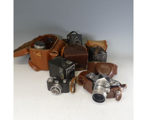 A collection of mid-20th century and later Cameras and Lenses, including;&nbsp;A Voigtlander Brillant reflex Camera,&nbsp;Bro