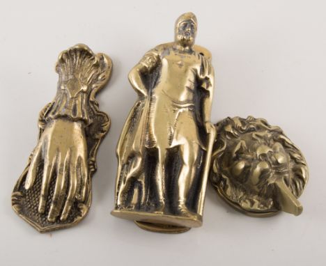 Cast brass figural door knocker, 15cm; other door knockers including fox mask, horseshoe,  together with a brass hand papercl