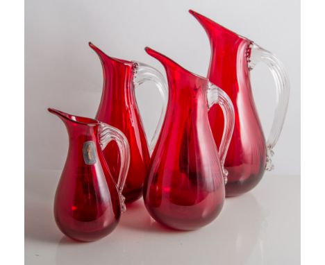 Whitefriars, four jugs, pattern 9419, ruby glass with clear handles, 21cm, 18cm, 17.5cm, and 12.5cm (4) 