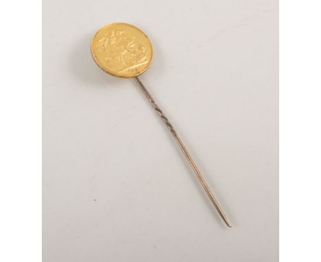 Yellow metal stick pin with Victorian sovereign.