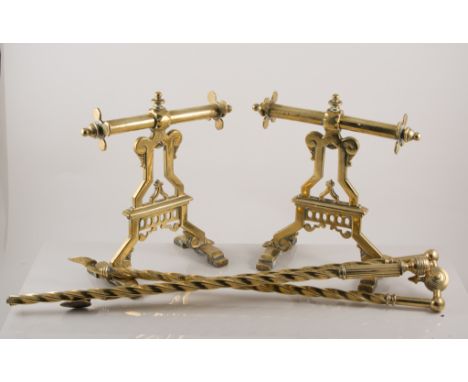 Set of brass fire irons, pierced fender and andirons and a fireguard.