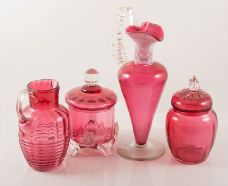 Cranberry glass jug, applied ribbed decoration to the spout, 26cm; and a collection of other Cranberry and Ruby glass.