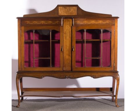 Edwardian mahogany side cabinet, raised back, marquetry inlay, rectangular serpentine top with a moulded edge, frieze and cen