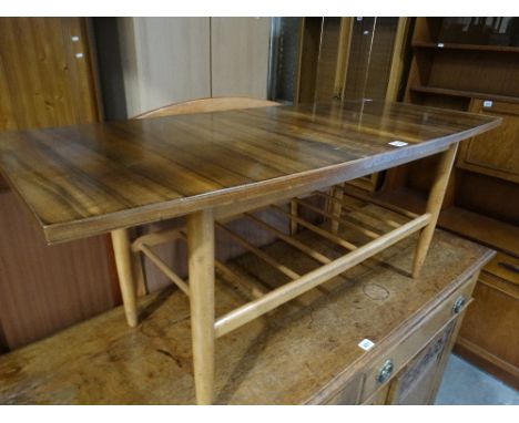     A Mid 20th Century Coffee Table With Magazine Shelf                             