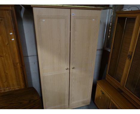     A Contemporary Light Wood Finish Two Door Wardrobe                              