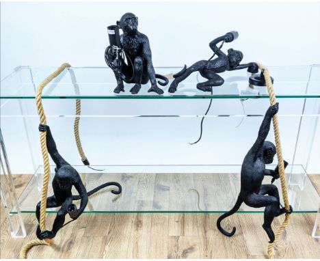 CHIMPANZEE LIGHTS, a set of four, differing and in various poses, including three wall lights and a table lamp, largest measu