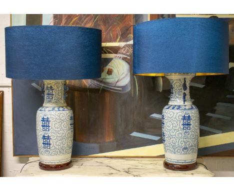 TABLE LAMPS, 92cm H x 61cm, a pair, Chinese blue and white ceramic with blue shades. (2) (loose fitting to one lamp) 