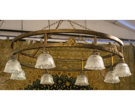 HANGING LIGHT, early 20th century brass with eight glass shades, 112cm x 29cm H excluding chain. 