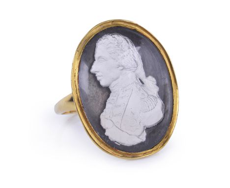 A COMMEMORATIVE PASTE MEDALLION MOUNTED AS A RING, after Tassie, mounted on a black ground with plain gold setting -- 1in. (2