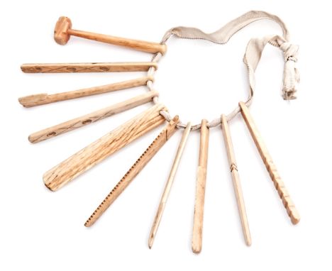 Ø A 19TH-CENTURY SET OF SAILORWORK MARINE IVORY MODEL TOOLS, comprising ten typical tools including saw, mallet, rasp, flensi