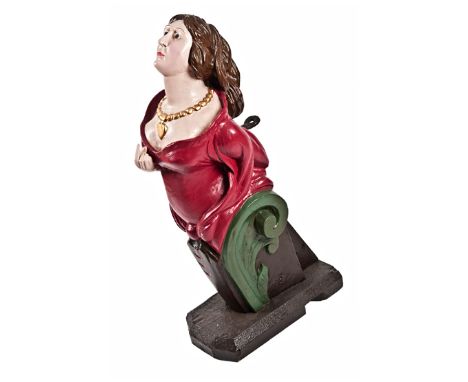 A MERCHANT FIGUREHEAD, CIRCA 1860, carved as a half-length woman with flowing locks, wearing a necklace and terminating in a 