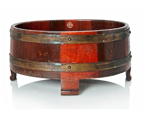 A PLANTER MADE FROM THE TIMBER OF H.M.S. TERRIBLE (1895), coopered in ovoid form with two brass bands and with provenance pla