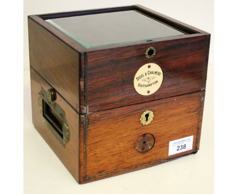 A TWO-TIER CHRONOMETER BOX, CIRCA 1925, with ivorine retailers label to front inscribed Steel & Chalmers / Southampton, bevel