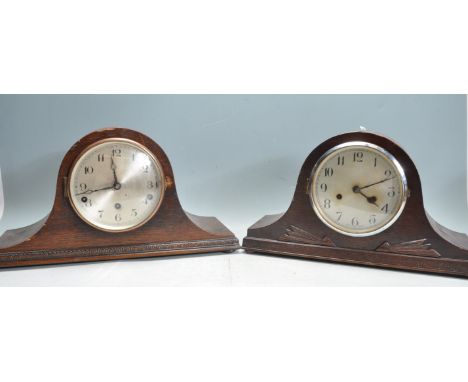 Two vintage 20th century oak cased 8 day napoleons hat mantel clock both having silvered faces with Arabic numerals to the ch