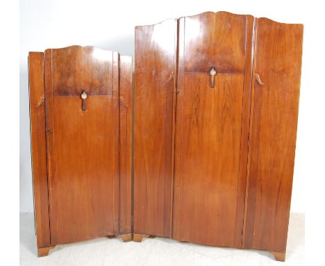 A vintage mid 20th century Art Deco style Lebus walnut veneer bedroom suite having large single door wardrobe with embossed h