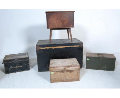 A vintage retro oak sewing box having a hinged lid with appointed interior raised on turned tapering legs together with an an