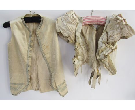 A mid-Victorian bodice with the original stays, hook and eye fastening, cream satin, cream brocade, ruched puff sleeves with 