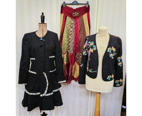 1990's black collarless coat&nbsp;with a tiered skirt, front pockets, edged with a white frayed detail, labelled 'Rachel Cout
