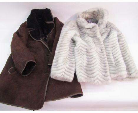 A vintage sheepskin coat, labelled Morelands, a pale blue 1940's wool coat and a camel coloured coat, also a 1990's faux fur 