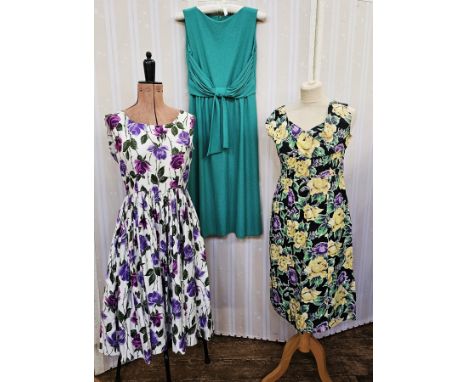 11 various vintage dresses&nbsp;to include a white cotton sleeveless sundress printed with purple flowers, a green crimplene 