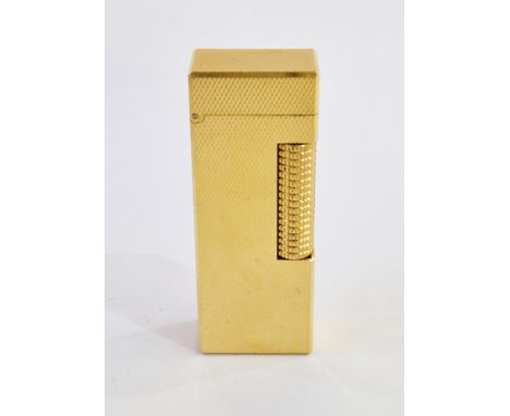 Alfred Dunhill, a mid 20th century Dunhill Rollagas pocket lighter, gold plated with engine turned decoration, US.RE24163 pat