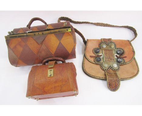 Small leather Gladstone-style bag, another Gladstone-style bag&nbsp;with chequered lozenge design, and&nbsp;leather bag with 