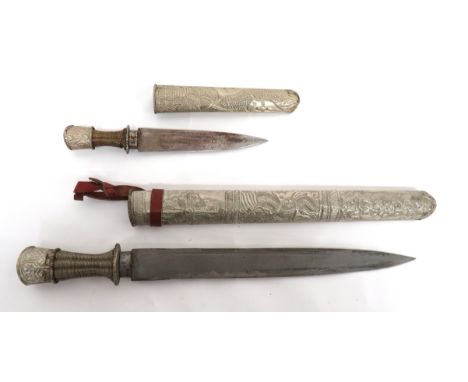 19th Century Pair Of Burmese Daggers consisting 12 inch, single edged blade. &nbsp;White metal, twist wire grip. &nbsp;White 