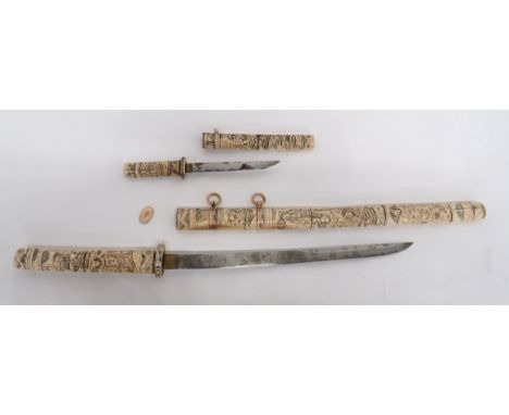 Late 19th Century Japanese Carved Bone Decorated Sword 16 1/2 inch, single edged blade. &nbsp;Brass habaki. &nbsp;Carved bone