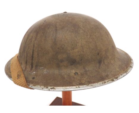 1942 Dated MKII Steel Helmet light khaki, rough texture finish. &nbsp;Black treated linen liner. &nbsp;Frame dated 1942. &nbs