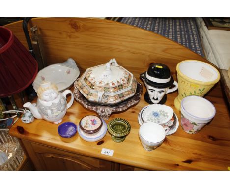 A box of mixed ceramics including Holkham, Rockingham, Wedgwood and a Charlie Chaplin teapot