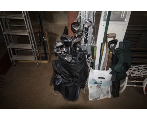 A Taylor Made golf bag and contents of clubs to include Titleist Titanium 975 driver, a quantity of RAM golfing irons and var
