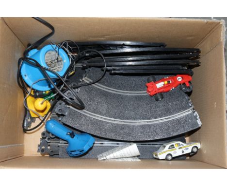 A box of various Scalextric 