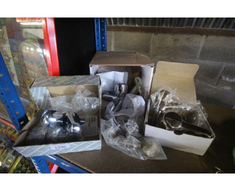 Two pairs of basin taps and a chrome mixer tap, all with original boxes