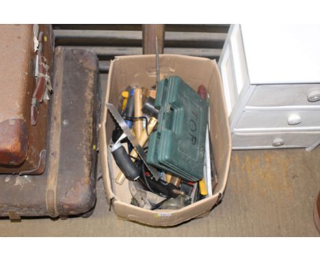 A box containing tools to include mallets, plasterers tools, small pick axe, safety goggles, spirit levels, screwdrivers, chi