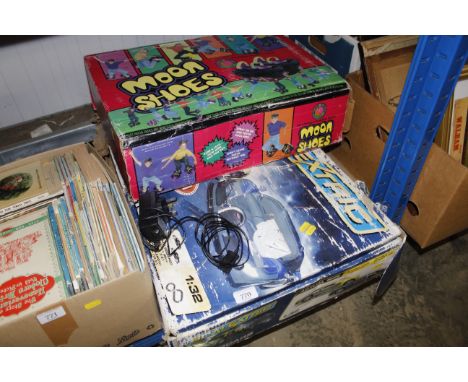 A pair of Moon shoes and box of Scalextric