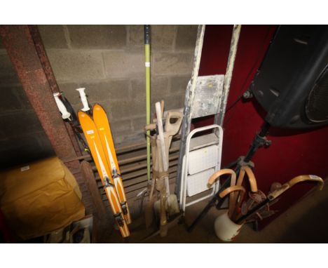 A quantity of various gardening tools to include forks, shovels, rakes, pick axe etc.