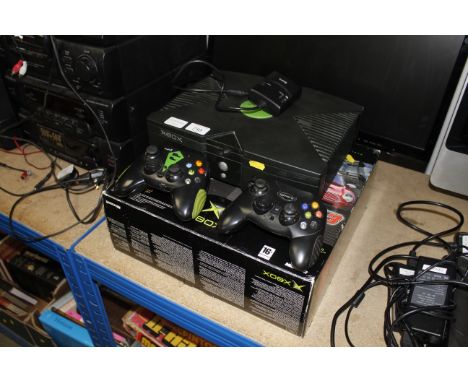 An X-Box games console, two controllers