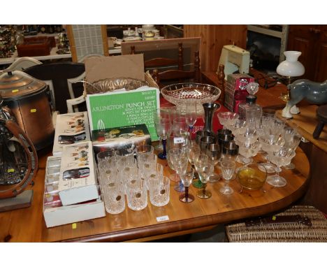 A collection of table glassware to include a punch bowl; decanter and glasses