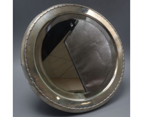 A George V silver mounted circular easel mirror, by Mappin &amp; Webb, London, 1910, diameter 36.5cm.