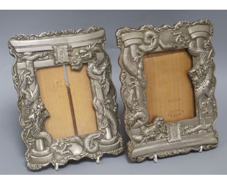 A pair of Japanese antimony 'dragon' photograph easel frames height 24cm