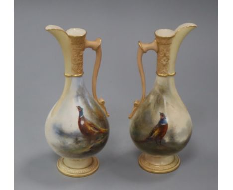 James Shinton for Royal Worcester. A pair of ewers height 18cm