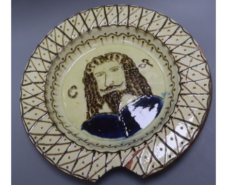 A 19th century slipware portrait dish diameter 42cm - a.f.