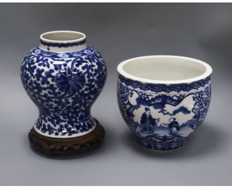 A Chinese blue and white jardiniere, Kangxi mark, and a similar vase, 20.5cm with hardwood stand