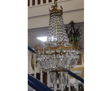 A gilt metal cut glass bag-shaped ceiling light and a pair of matching wall lights