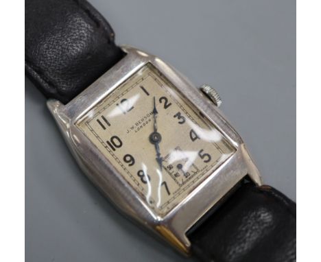 A gentleman's 1930's silver manual wind wrist watch, retailed by J.W. Benson, on leather strap in Benson box.