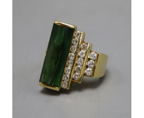 A continental 18k, green tourmaline and diamond set dress ring, bearing the stamp 'Hubert', size M.