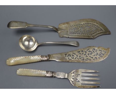 A pair of late Victorian silver fish servers, Sheffield, 1898, a William Iv silver fish slice and a silver sauce ladle.