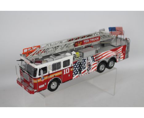 Code 3 Collectibles - A 2001 Seagrave 100 foot rearmount aerial ladder in 1:32 scale in FDNY  Ladder Company 10 livery, this 