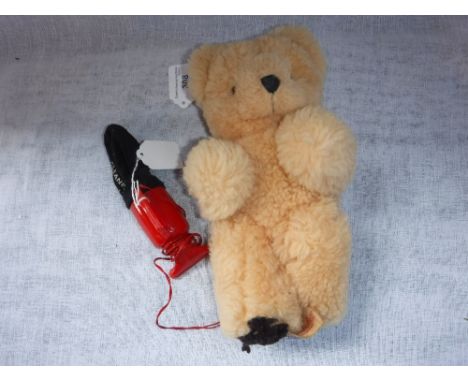 A VINTAGE TINKERBELL plush bear, with internal musical action, playing 'Teddy Bears Picnic' and a vintage 'Ever Ready' toy 'D